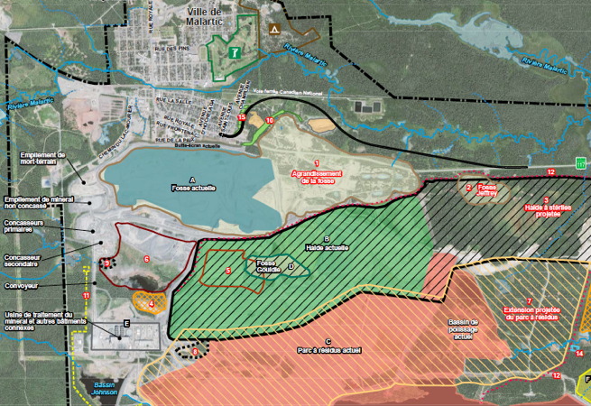 Capture-écran d'une carte de style « photo vue de l'espace » mais où les fosses et zones sont marquées en couleur. La fosse tout près de la ville ressemble à un grand lac.