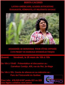 Affiche : photo de Berta dans une forêt tropicale. Elle est en train d'expliquer quelque chose. Cheveux longs noirs ondulés ; chemise carreautée rouge - blanc. Les détails de l'affiche sont transcrits dans l'annonce ici.