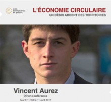 Affichette : photo de face de M. Aurez : jeune homme cheveux courts brun, regard intelligent. Logo du Club économique de Québec, soit un E jaune d'oré dans un cercle de la même couleur.